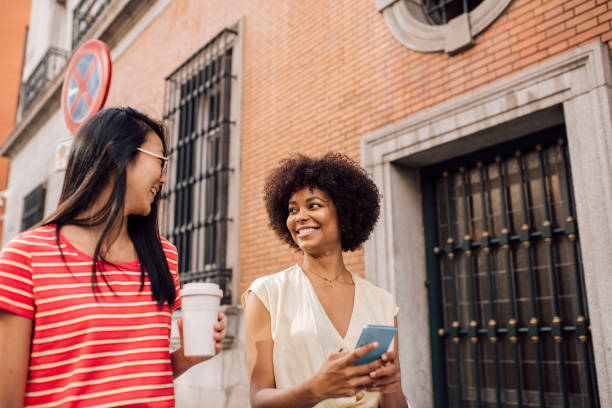istock Two multiracial friends enjoying their vacation in Madrid 1400430275