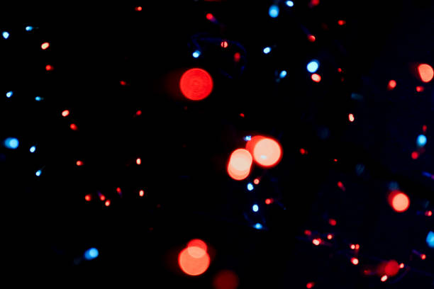 istock Blue red white dot Lighting illumination and decoration items bokeh on black for Christmas and New Year Celebration 1400434305