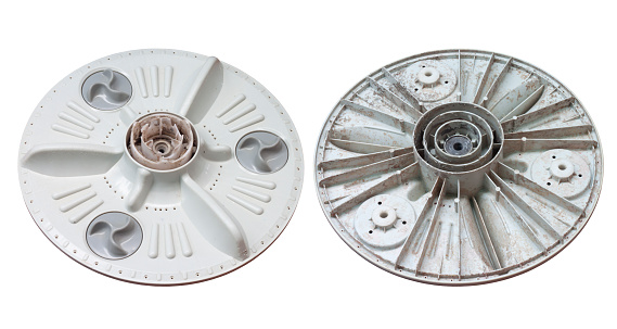 Damaged and stain dirt under pulsator  of washing machine isolated on white background with clipping path.