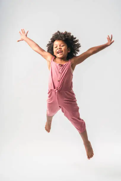 Photo of Sporty Black Little Girl Jumping High