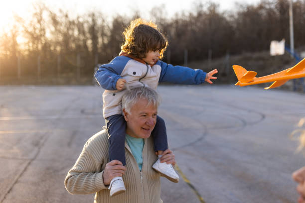 istock Toddler boy playing with airplane toy 1400437841