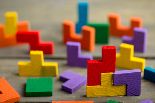 istock Creative solution for idea - business concept, jigsaw puzzle on the wooden desk 1400438772