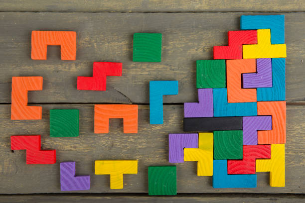 istock Creative solution for idea - business concept, jigsaw puzzle on the wooden desk 1400438846