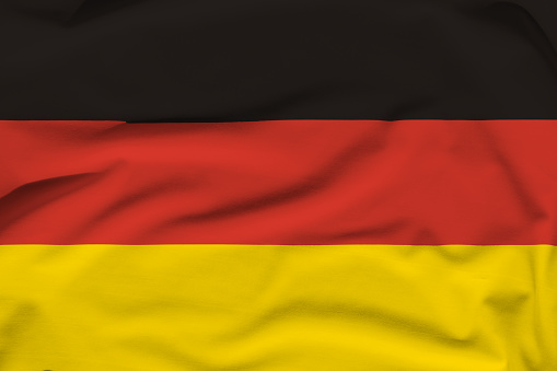 Germany national flag, folds and hard shadows on the canvas.