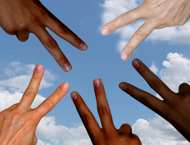istock Black and white hands in peace sign. 1400439148