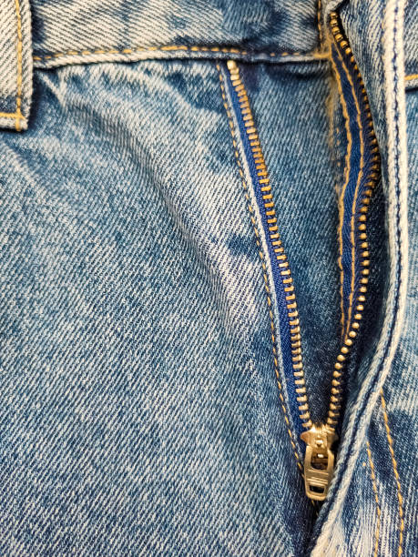 istock Zipper on jeans. Jeans texture. Close-up denim background. Unzipped jeans. 1400440699