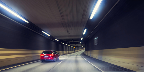 Car view of a highway through a tunnel in central Stockholm.