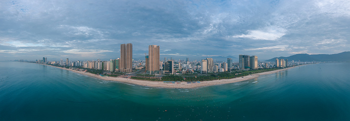 Drone view panorama Da Nang city from the sea in a cloudy day, Quang Nam Da Nang province, central Vietnam