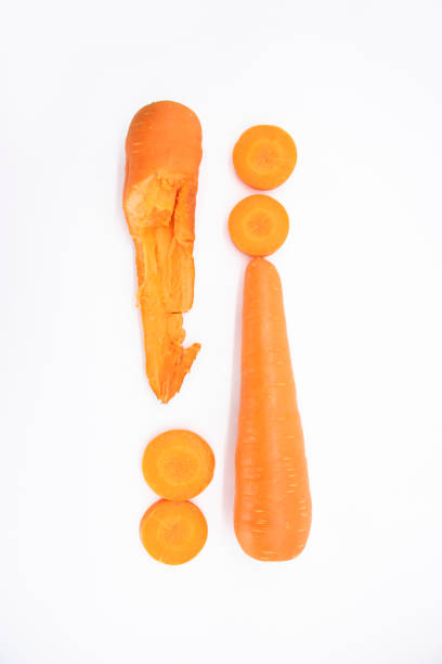 istock whole carrot and cut carrot pieces isolated on white background as package design element 1400443459