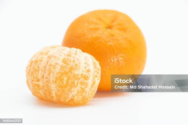 Whole And Slice Tangerine Or Komola Isolated On White Background Top View Stock Photo - Download Image Now