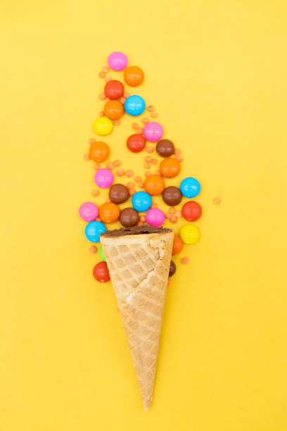 istock crispy candy over on yellow background, top view 1400443715