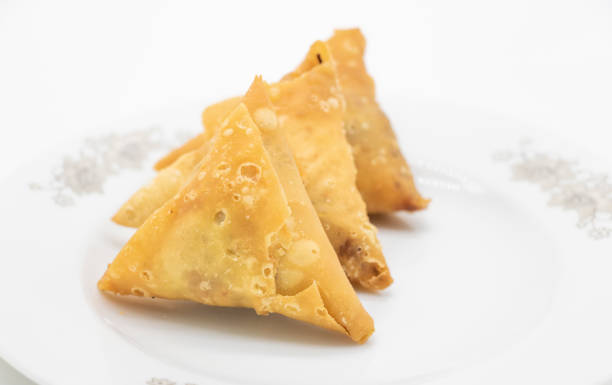 istock three pieces golden samosa isolated on white background 1400443836