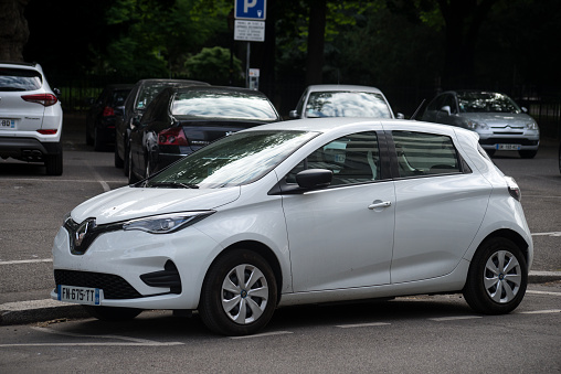 Mulhouse - France - 31 May 2022 - Profile view of white Renault Zoe, the famous french electric car parked in the street