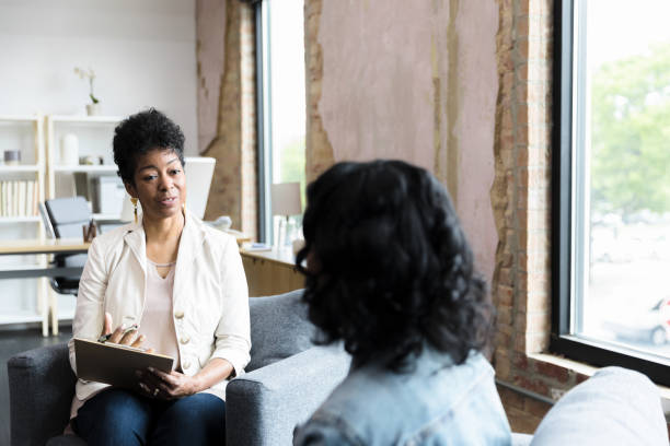 istock Female therapist gestures while sharing solutions with unrecognizable teen girl 1400445775