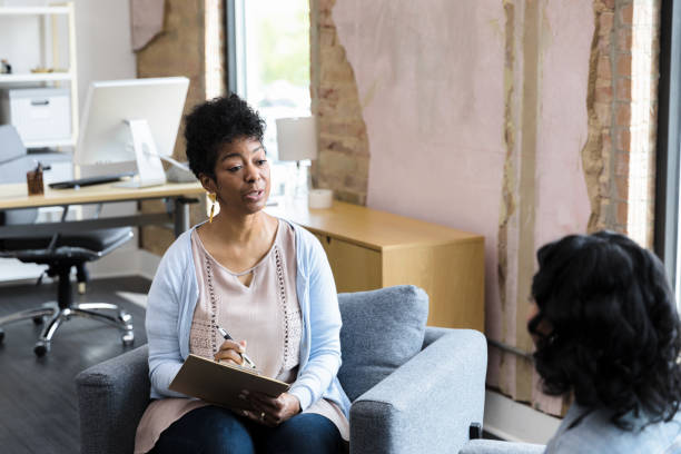 istock Female counselor asks girl question to clarify a point 1400445777