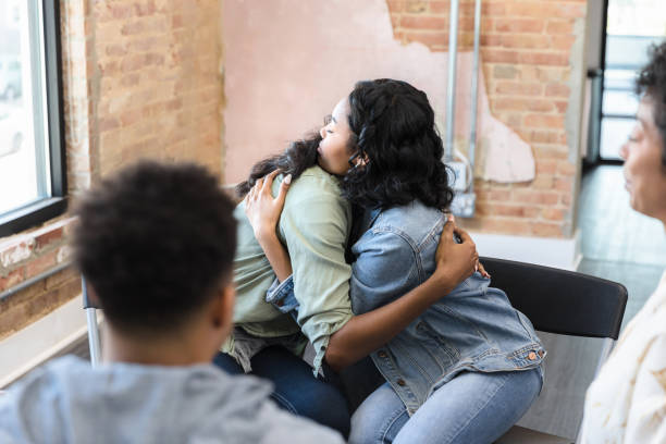 istock Sisters embrace as they reconcile during therapy session 1400445798