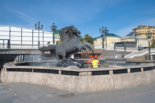 Moscow, Russia - September 29, 2021: Workers wash the sculptural composition \