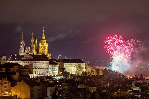 Fireworks over the Old Town of Prague, Czech Republic. New Year fireworks in Prague, Czechia. Prague fireworks during New Year Celebration near St. Vitus Cathedral, Prague, Czech republic.