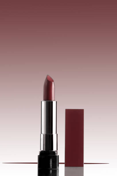 istock Mauve lipstick isolated on graduated color background 1400454477