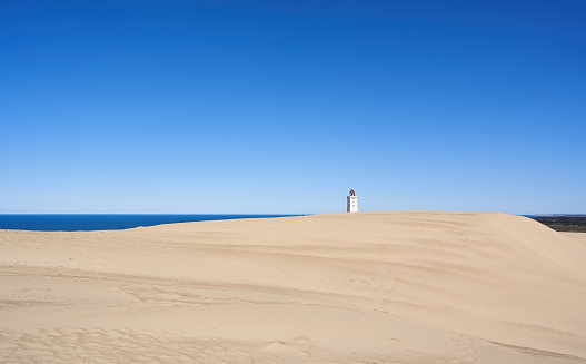 Smooth sand dunes with waves under bright summer sunlight under clear blue sky, natural 3D illustration