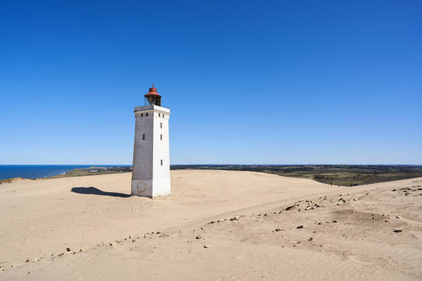 istock Rubjerg Knude lighthouse at coastline against clear sky 1400455310