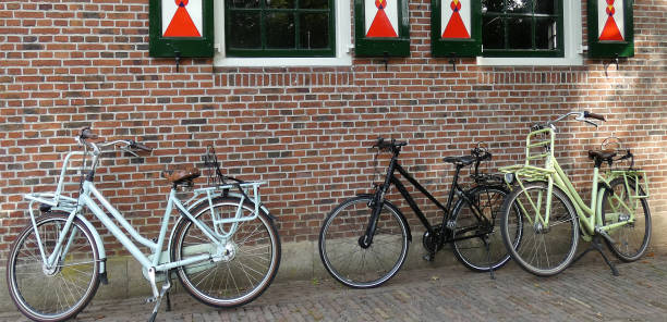 istock Three bicycles in front of an old wall 1400457080