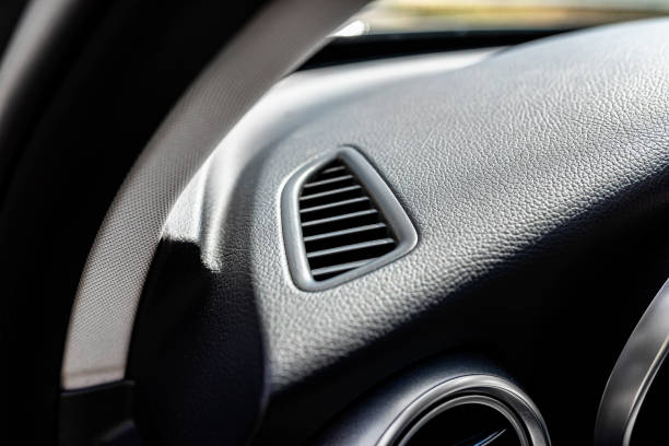 istock The interior of a modern passenger car with a visible rectangular airflow directed at the drivers side window. 1400457151