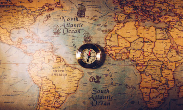 istock Map with compass. Simple navigation tools to orient in the world. The map used for background is in Public domain. Map source: Library of Congress. Country: Belgium Year: 1570. Author: Abraham Ortelius (1527-1598) 1400458339