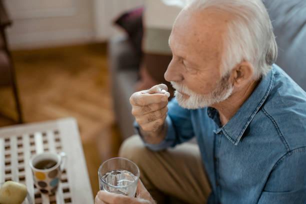 istock Senior Male taking Pills 1400459045