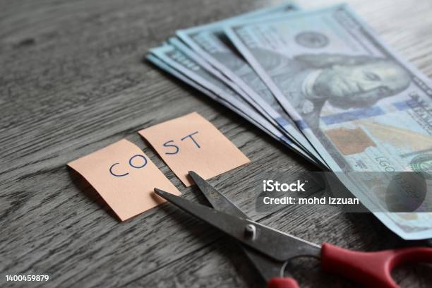Scissor Money And Note With Text Cost Stock Photo - Download Image Now - Cutting Costs, Cutting, Loss