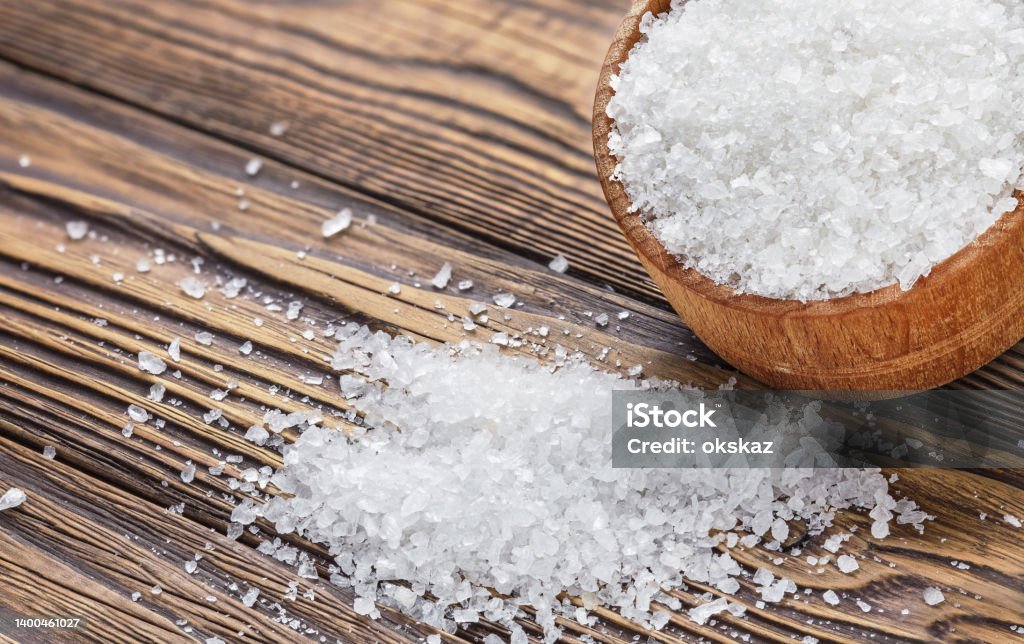 salt in a hodgepodge on a wooden table Close To Stock Photo