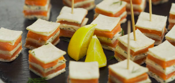 mini canapes with smoked salmon - canape appetizer gourmet salmon imagens e fotografias de stock