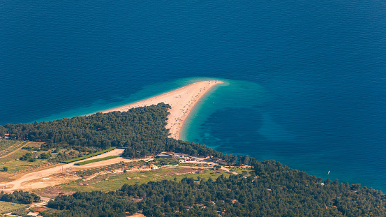 Zlatni Rat (Golden Cape or Golden Horn) famous turquoise beach in Bol town on Brac island, Dalmatia, Croatia. Zlatni Rat sandy beach at Bol on Brac island of Croatia in summertime.