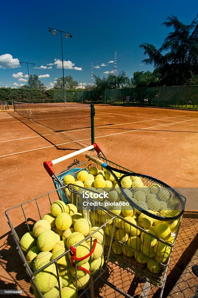 Tennis court in a sunny day View of a tennis court in a sunny day. Clay Stock Photo