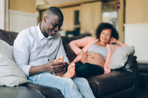 istock Husband massaging his wife's feet 1400468971