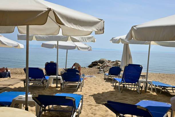 istock sunbeds and umbrellas on beach 1400469060