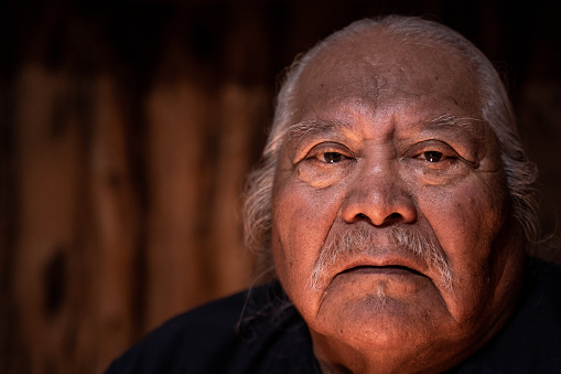 Elder Indigenous Navajo Man Portrait in a Traditional Navajo Hogan in Monument Valley Utah