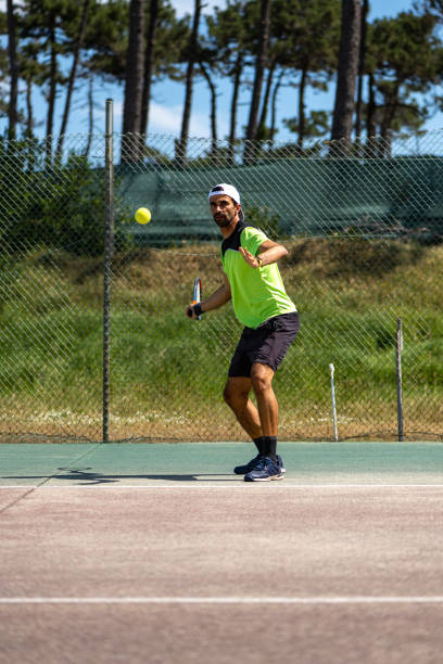 istock Tennis player hitting forehand at ball 1400471571