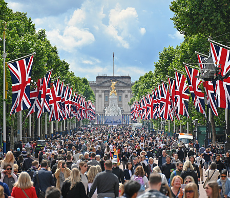 London, UK. May 23 2022. Union Jack flags in The Mall leading to Buckingham Palace for the Queen's Platinum Jubilee, marking the 70th anniversary of the Queen's accession to the throne.