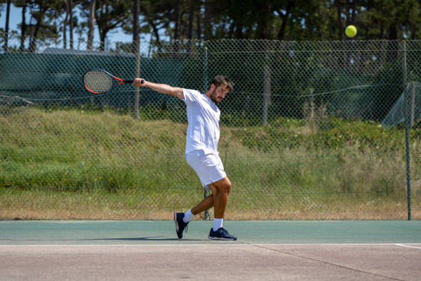 istock Tennis player hitting backhand at ball 1400472369