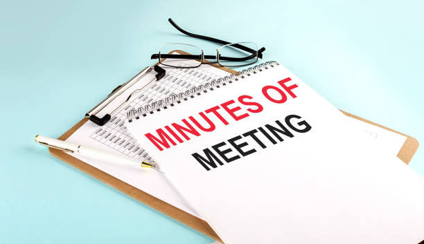 istock MINUTES OF THE MEETING text on notepad on clipboard with chart on blue background, concept closeup. Business and finance concept 1400474103