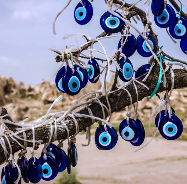 istock Traditional blue evil eyes. Tree with popular Turkish souvenir. 1400475198