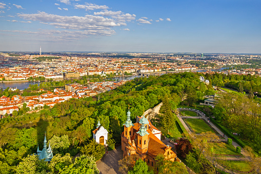 Prague city landscape view in spring, Czech Republic. Panoramic view on church and Vltava river.