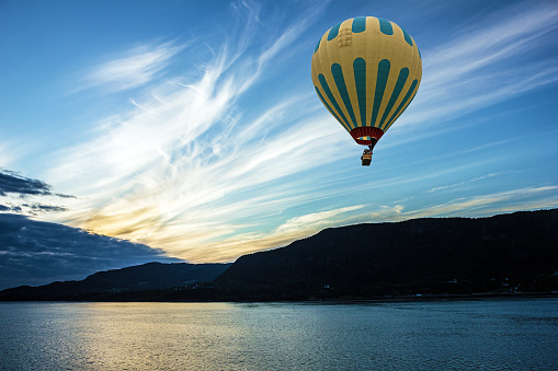 Hot air balloon over fjords, Norway