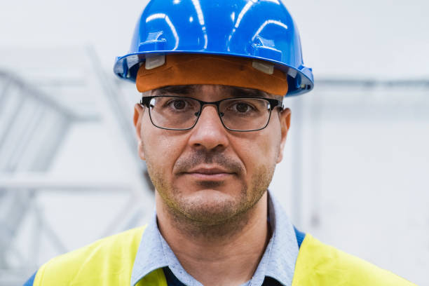 istock Engineer working inside automation and robotics facility - New industrial technology concept - Focus on face 1400475440