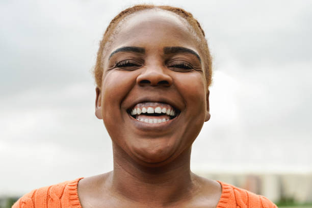 istock Curvy African young woman smiling on camera - Focus on eyes 1400475589