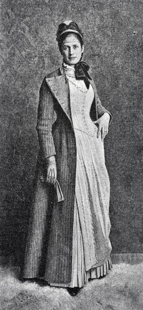 istock Elegant lady, standing, full length,  hand on hip, long coat and dress 1400476675