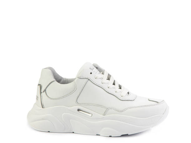 istock White classic leather trainers. Casual women's style. White lacing and white rubber soles. Isolated close-up on white background 1400480109
