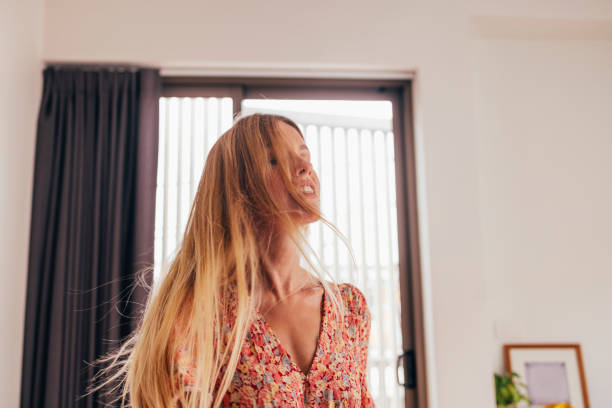 istock Blonde Woman Dancing In Her Bedroom 1400481146