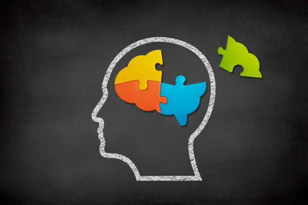 istock Brain shaped jigsaw puzzle on black background, a missing piece of the brain puzzle, mental health and problems with memory 1400481308